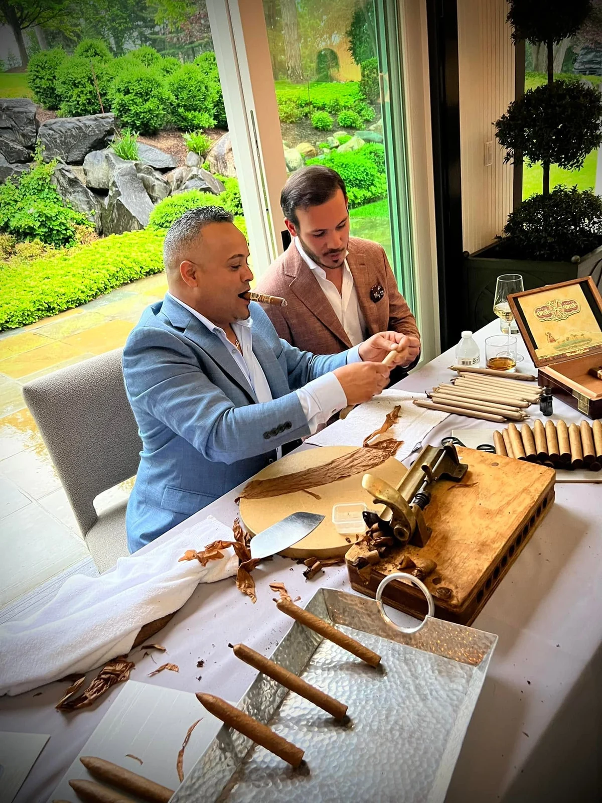 Franklin working at his table under the tent at Cars & Cigars, Detroit
