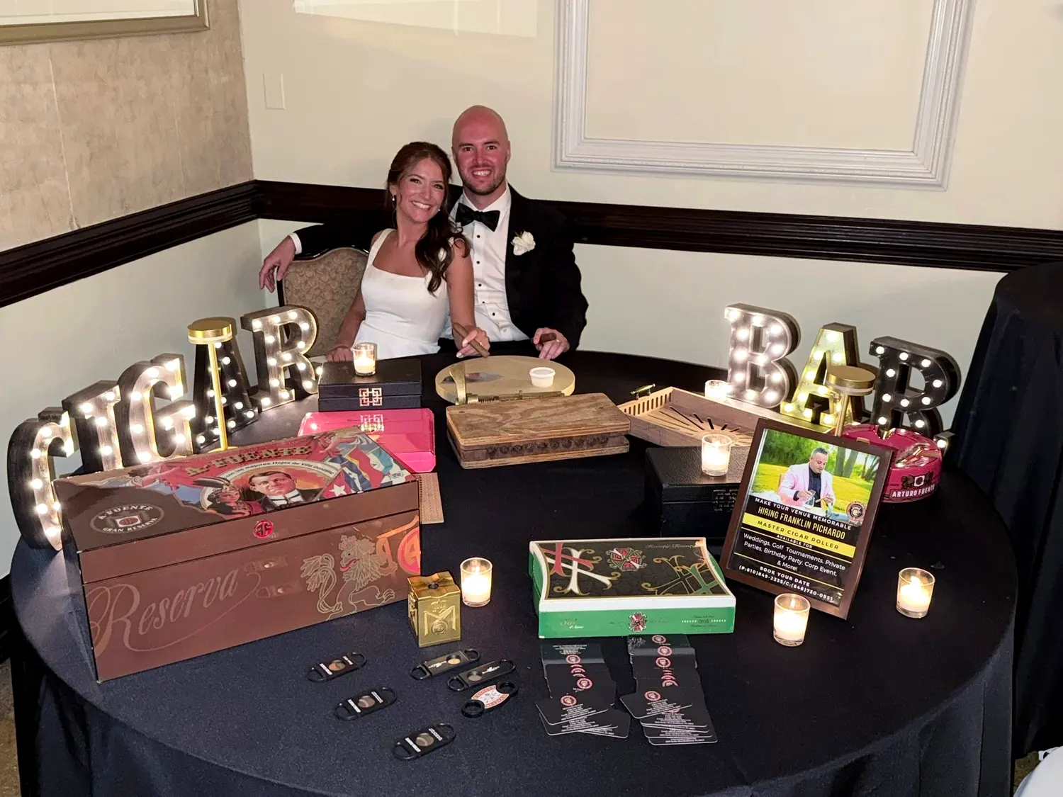 The cigar bar table, with the couple behind it
