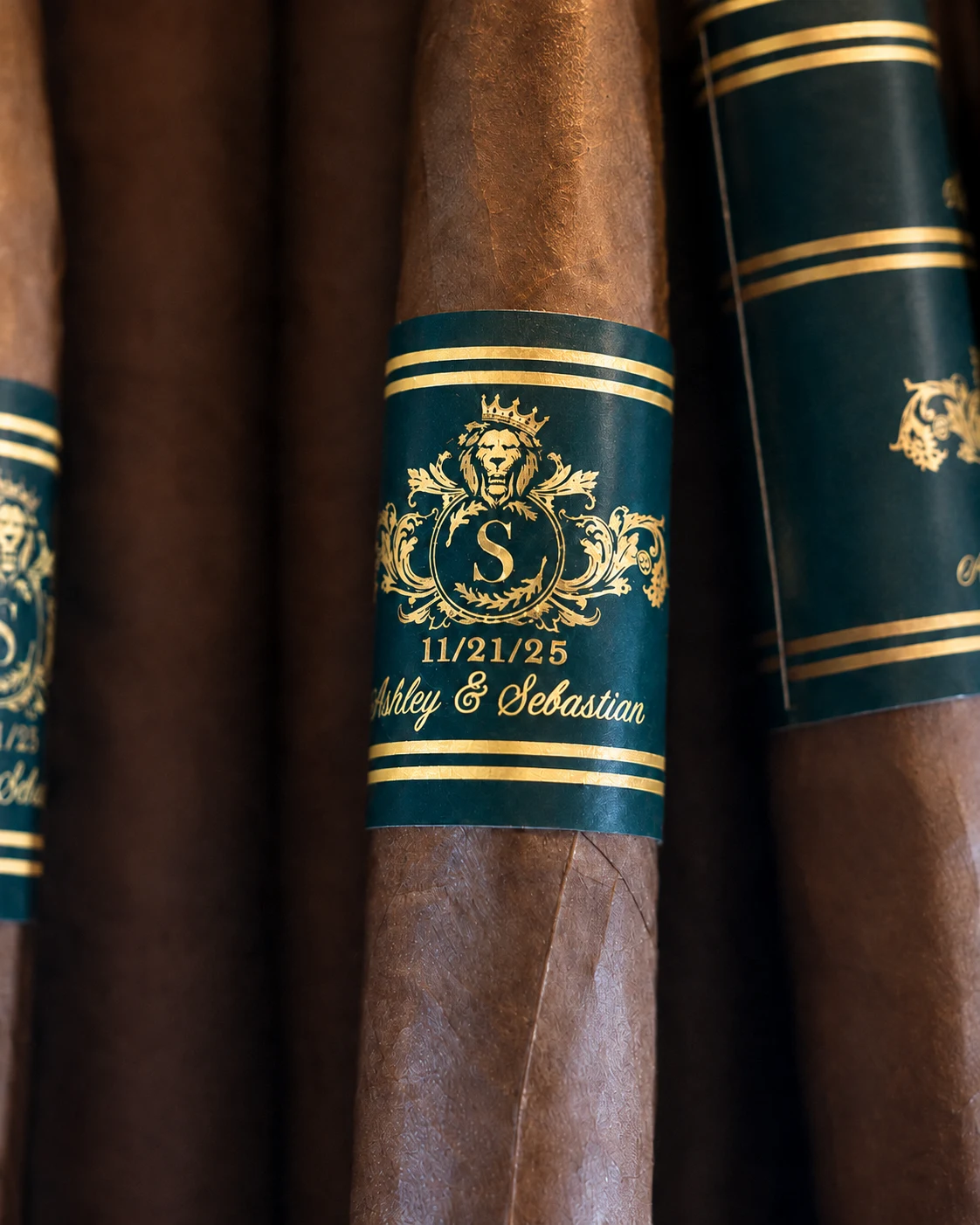 A green and gold cigar band with a crest and a monogram, printed for one of his events