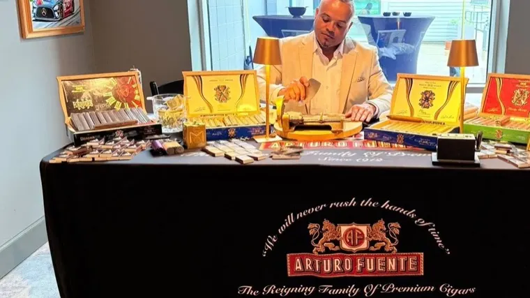 Franklin Pichardo at an Arturo Fuente table