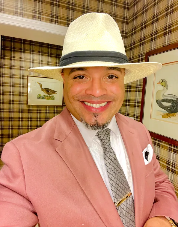 Franklin Pichardo in his panama hat, smiling at the camera